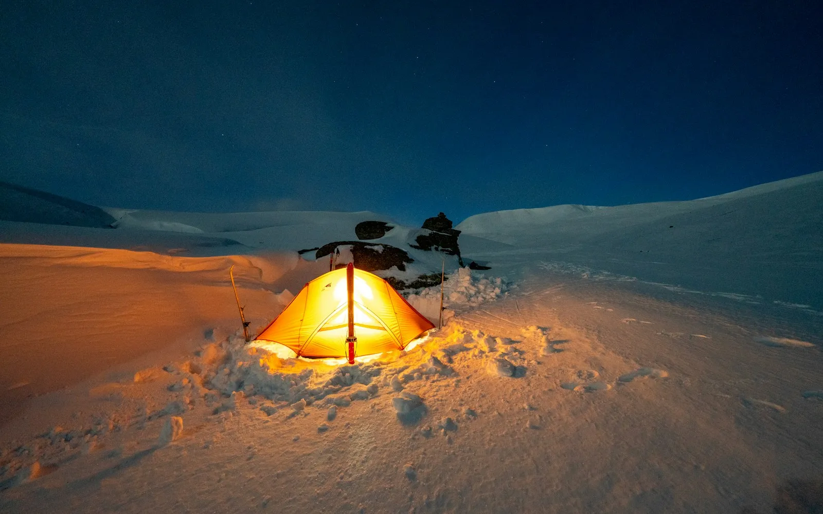 Small tent camp tucked into a backcountry clearing